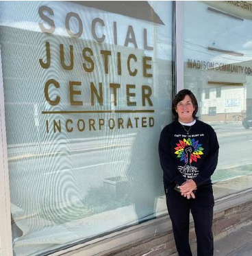 Kristin Mathews in front of the Social Justice Center