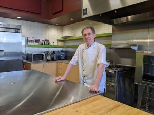 Pierre Ferland standing in a large kitchen