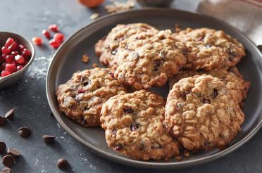 Chocolate chip oat pomegranate cookies on a plate