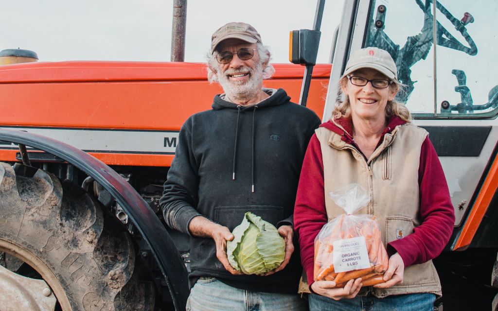 Steve and Beth in front of a tractor