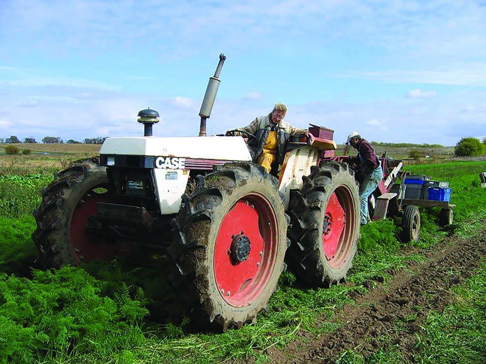 Driving a tractor through fields.